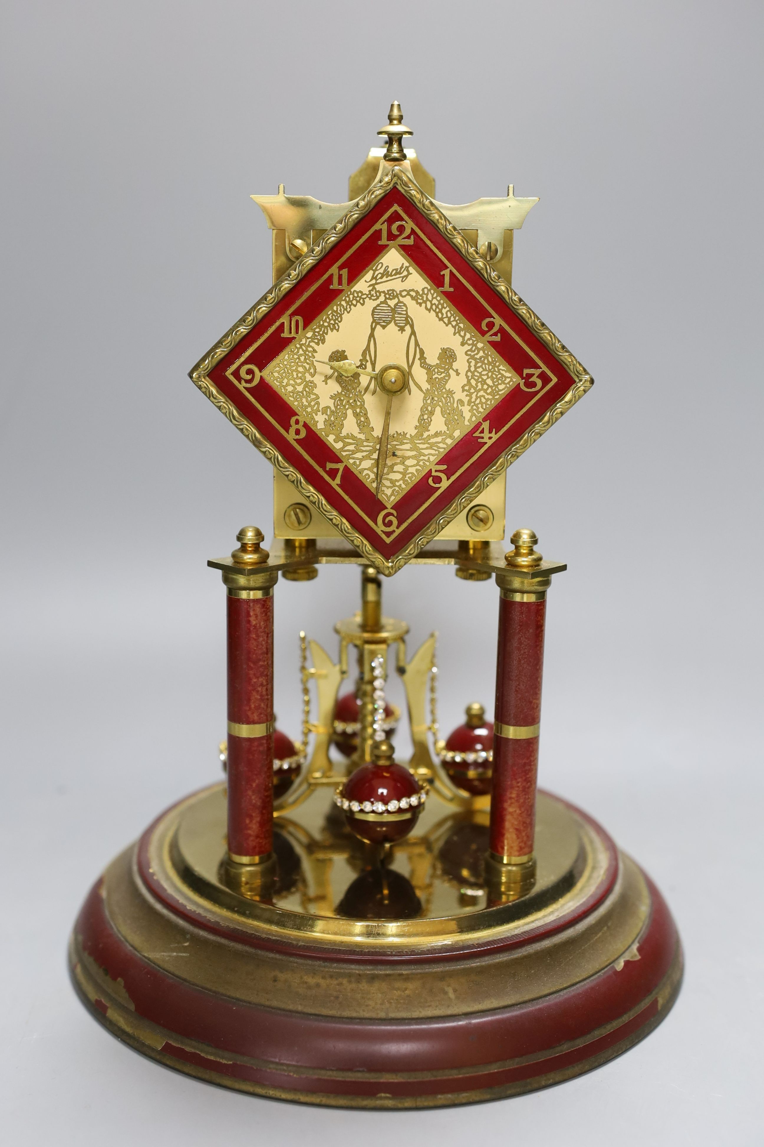 A domed Schatz 400-day anniversary red type design dial clock - 31cm tall